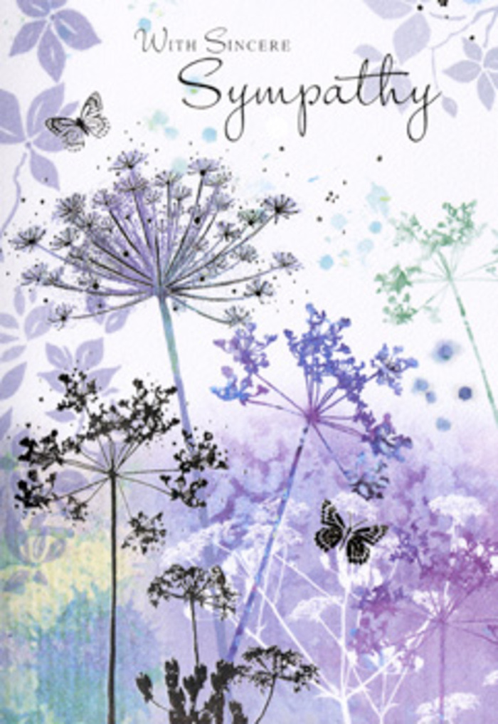 The artwork on this sympathy card feels like a calm pause beside the open spaces of Totteridge Green, translated into watercolour and light. A cluster of tall, spidery wildflowers rises from the lower edge of the design, each stem long and elegantly arched, crowned with fine, umbrella-shaped sprays reminiscent of cow parsley and other umbelliferous blooms. They are rendered in delicate lines and transparent layers of lavender, powdered violet, and cool blue, with hints of silvery green tracing the stems and feathery foliage. The flowers are not crowded; instead, they stand apart, giving the eye room to travel from one intricate head to another, much like noticing individual seed heads swaying in a quiet field. Behind them, the background melts into a dreamy wash of violet, mauve, and pale steel blue, softly blended so no hard edges remain. This haze of colour evokes a gentle sky over the Totteridge Valley after rain, when everything feels hushed and reflective. Two light, almost ghostlike butterflies hover near the upper blossoms, their wings suggested rather than fully drawn, hinting at the fragile beauty of memories and the continuation of spirit. The overall palette stays cool yet comforting, calming the mind without feeling cold. The card's smooth surface and carefully balanced composition mirror the way a considerate florist chooses each stem for a funeral tribute-quietly respectful, never overwhelming. It offers a visual space for grief and remembrance, ideal for sending a heartfelt message of sympathy to families in Totteridge and nearby villages who appreciate nature's soft, consoling touch.