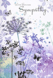 This sympathy card carries a gentle, meadow-like scene that could easily be imagined just beyond the quiet gardens and open fields of Totteridge. Across the front, slender wildflower stems rise in an airy dance, their umbel-shaped heads sketched with lace-like detail in shades of lavender, indigo-tinged blue, and muted lilac. Each bloom seems almost translucent, as if formed from layers of soft breath rather than ink and paint, the tips dissolving into the surrounding haze. The background is a smooth sweep of watercolour purples, powdery blues, and cool grey-greens, flowing together like distant hedgerows softened by evening light. No strong outlines interrupt the calm; instead, the colours merge gently, leaving the impression of a peaceful, twilight garden rather than a sharply defined scene. Floating between the stems, two delicate butterflies drift with wings barely tinted, their presence a quiet suggestion of hope, transformation, and the way love can linger even after a farewell. The light across the design is diffused and soothing, as if filtering through high cloud on a still day, inviting the viewer to breathe a little more slowly. You might imagine running your fingers over the card's smooth, slightly textured surface, feeling the subtle rise of the printed lines. Like a thoughtfully arranged condolence bouquet prepared for a local family in Totteridge, the artistry here is understated but deeply considered, offering a respectful, nature-inspired way to convey sincere sympathy and gentle remembrance.